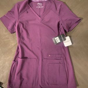 Cherokee Iflex Women's V-Neck Solid Knit Panel Scrub Top in color Eggplant